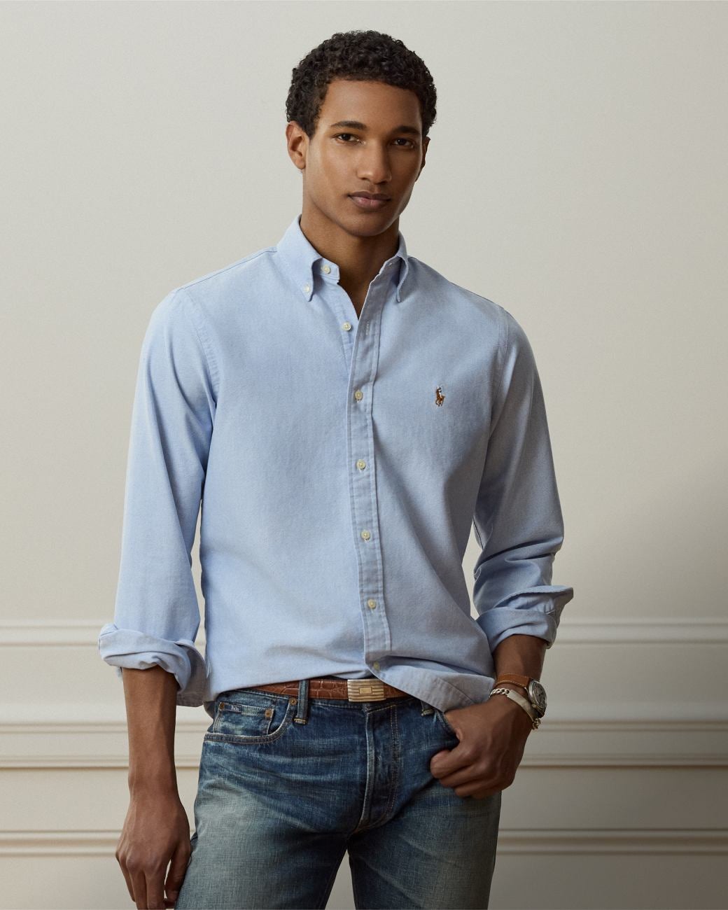 Man wears Classic Fit blue button-down shirt.